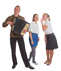 Image showing Two girls and a guy with an accordion 