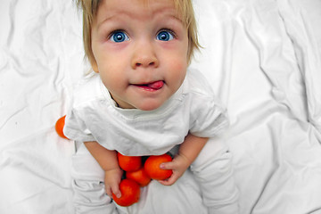 Image showing little boy with oranges