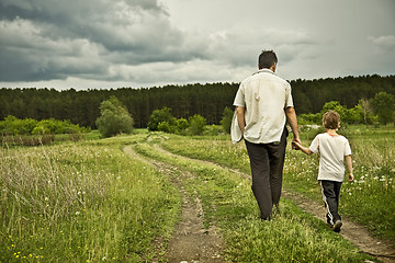 Image showing boy and his father are on the road