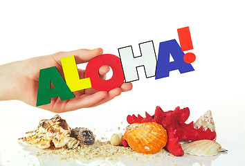 Image showing Female hand holding colorful word Aloha