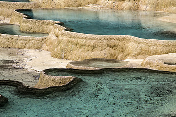 Image showing colorful pools formed by calcite deposits 