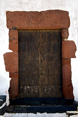 Image showing brass brown  door and white wall lanzarote 