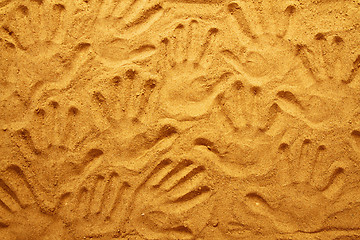 Image showing hand prints in the sand