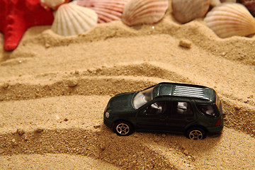 Image showing small toy car in the sand