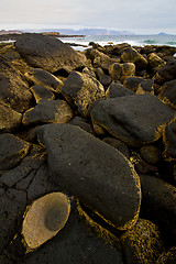 Image showing rock stone sky cloud beach  coastline and summer in lanzarote sp