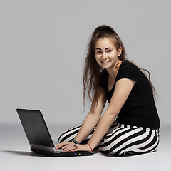 Image showing Teenager girl with laptop