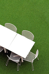 Image showing Chair and table on lawn at outdoor