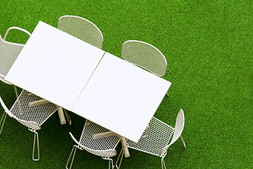 Image showing Outdoor chair and table on lawn