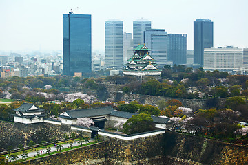 Image showing Osaka cityscape with traditional castle