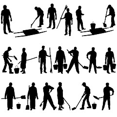 Image showing Set of black silhouettes of men and women with shovels and bucke