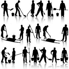 Image showing Set of black silhouettes of men and women with shovels and bucke