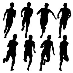 Image showing Set of silhouettes. Runners on sprint, men. vector illustration.