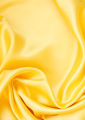 Image showing Smooth elegant golden silk as background 