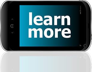 Image showing smart phone with learn more word, business concept