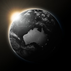 Image showing Sun over Australia on dark planet Earth