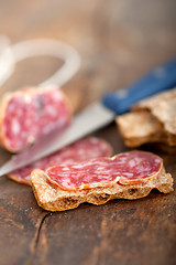 Image showing italian salame pressato pressed slicing