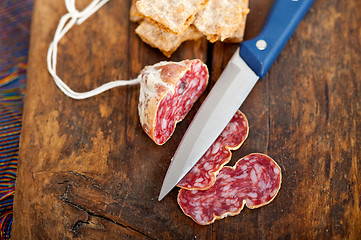 Image showing italian salame pressato pressed slicing