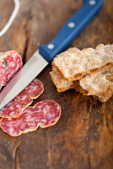 Image showing italian salame pressato pressed slicing