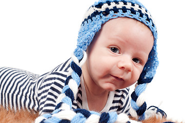 Image showing Newborn baby in striped body and hat