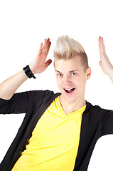 Image showing Handsome man with stylish haircut and hands raised