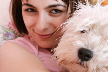 Image showing Dog sleeping on bed 