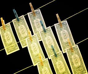 Image showing Dollars on the wire