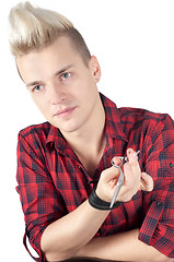 Image showing Portrait of man in red with pair of scissors