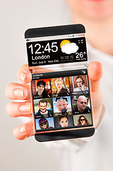 Image showing Smartphone with transparent screen in human hands.