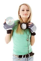 Image showing girl with headphones holding cd