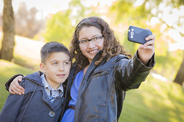 Image showing Brother and Sister Taking Cell Phone Picture of Themselves