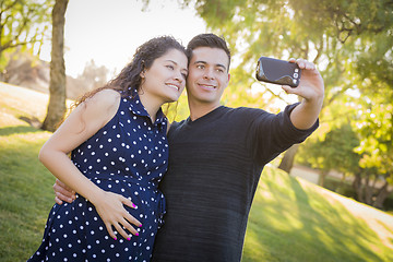 Image showing Pregnant Wife and Husband Taking Cell Phone Picture of Themselve