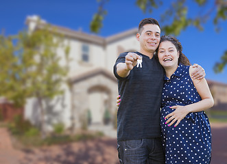 Image showing Hispanic Couple with House Keys In Front of New Home