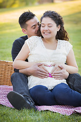 Image showing Pregnant Hispanic Couple Making Heart Shape with Hands on Belly