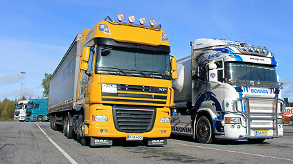 Image showing Colorful Trucks on a Yard