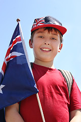 Image showing Smiling boy with flag