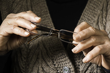 Image showing Women hands hold glasses