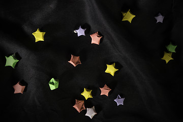 Image showing Multicolor origami stars on back satin