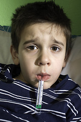 Image showing Sick child in bed.