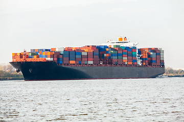 Image showing Fully laden container ship in port