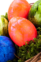 Image showing Basket of brightly coloured Easter Eggs