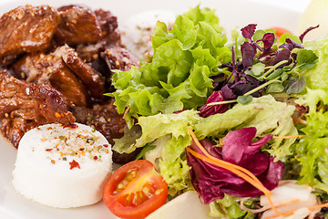 Image showing grilled beef stripes fresh salad and goat cheese