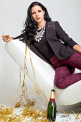 Image showing Seductive brunette holding a glass of champagne