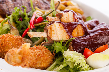 Image showing Platter of mixed meats, salad and French fries