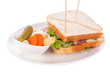 Image showing Delicious pastrami club sandwich and pickles