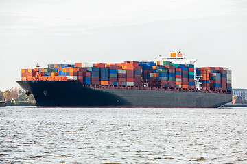 Image showing Fully laden container ship in port