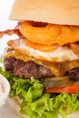 Image showing Delicious egg and bacon cheeseburger