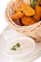 Image showing Crumbed chicken nuggets in a basket