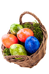 Image showing Basket of brightly coloured Easter Eggs