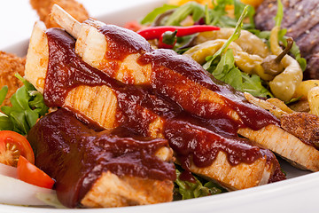 Image showing Platter of mixed meats, salad and French fries