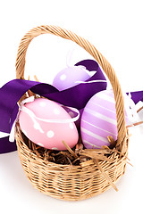 Image showing Straw basket with traditional Easter eggs